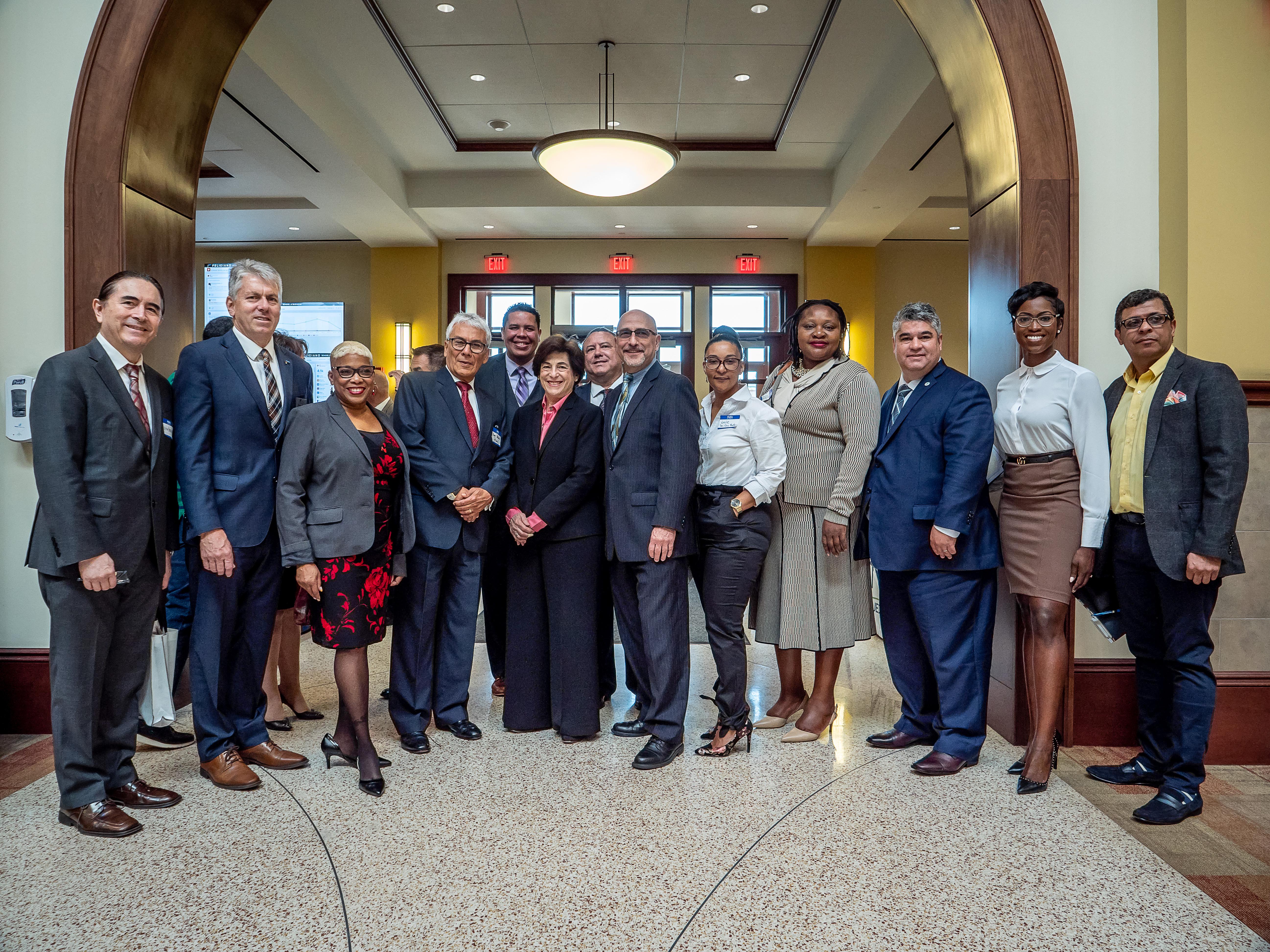 University administrators at People standing around at Latino Small Business Forum
