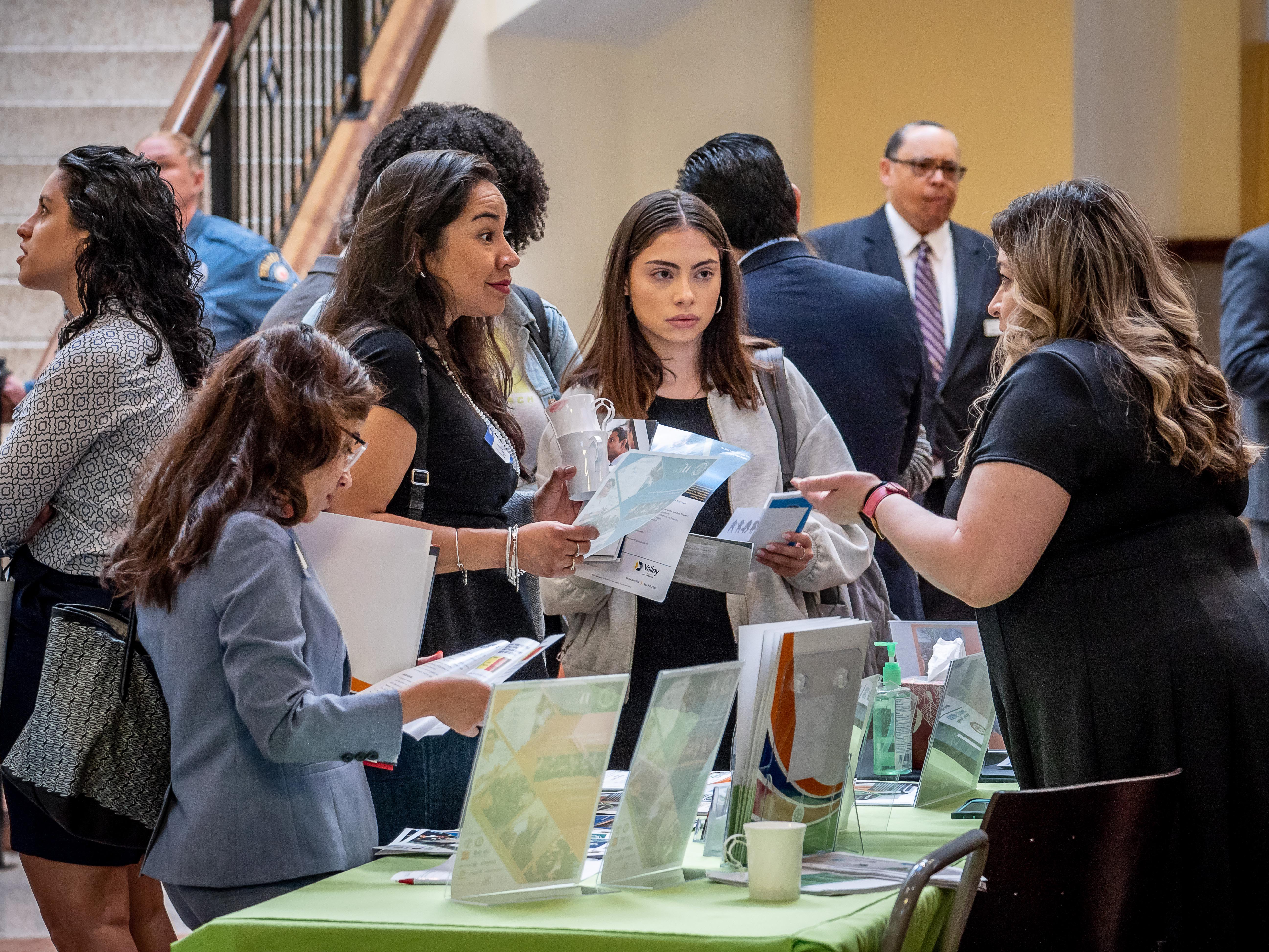Students at People standing around at Latino Small Business Forum