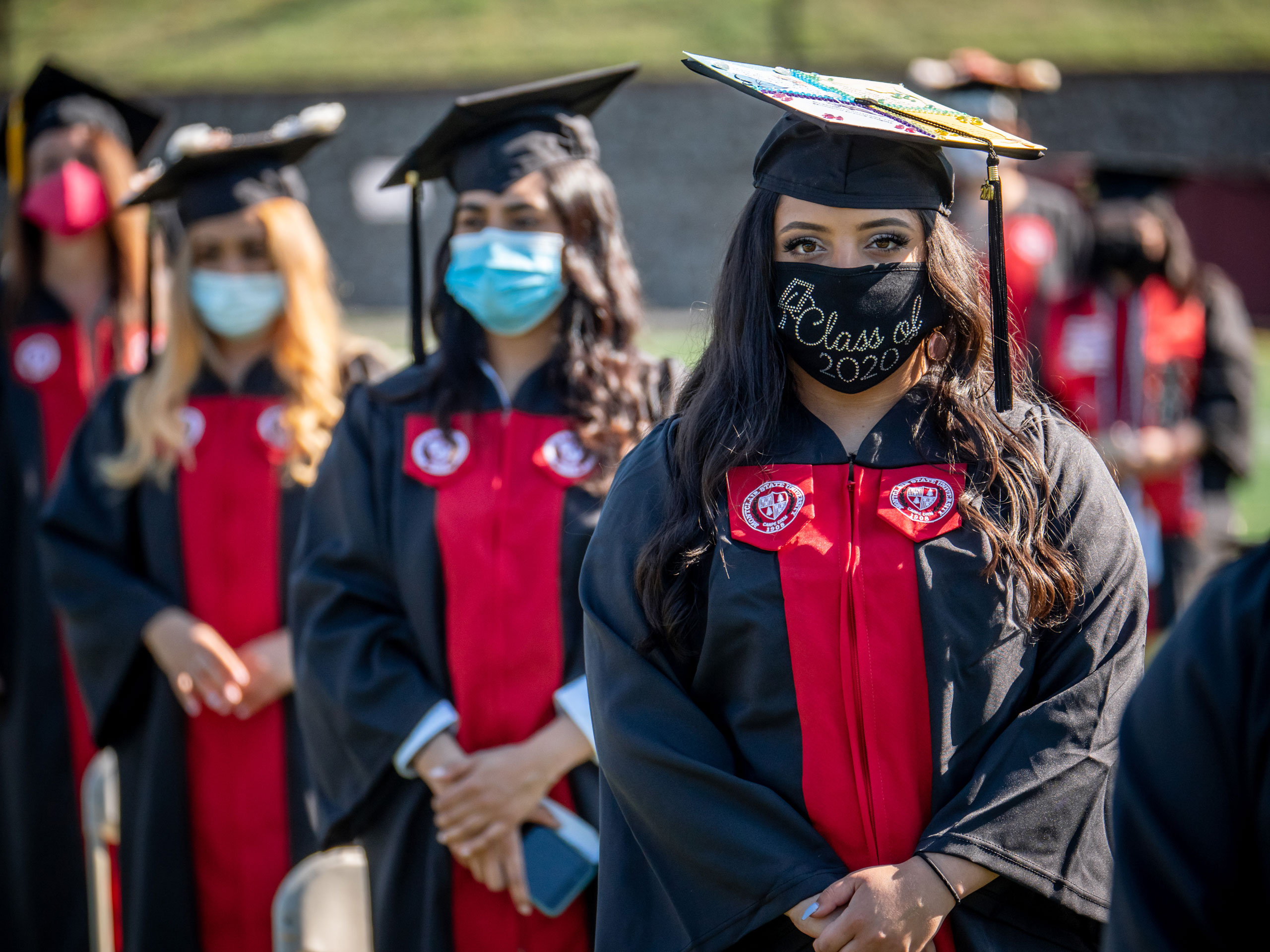 foreshortened view of robed graduates in line