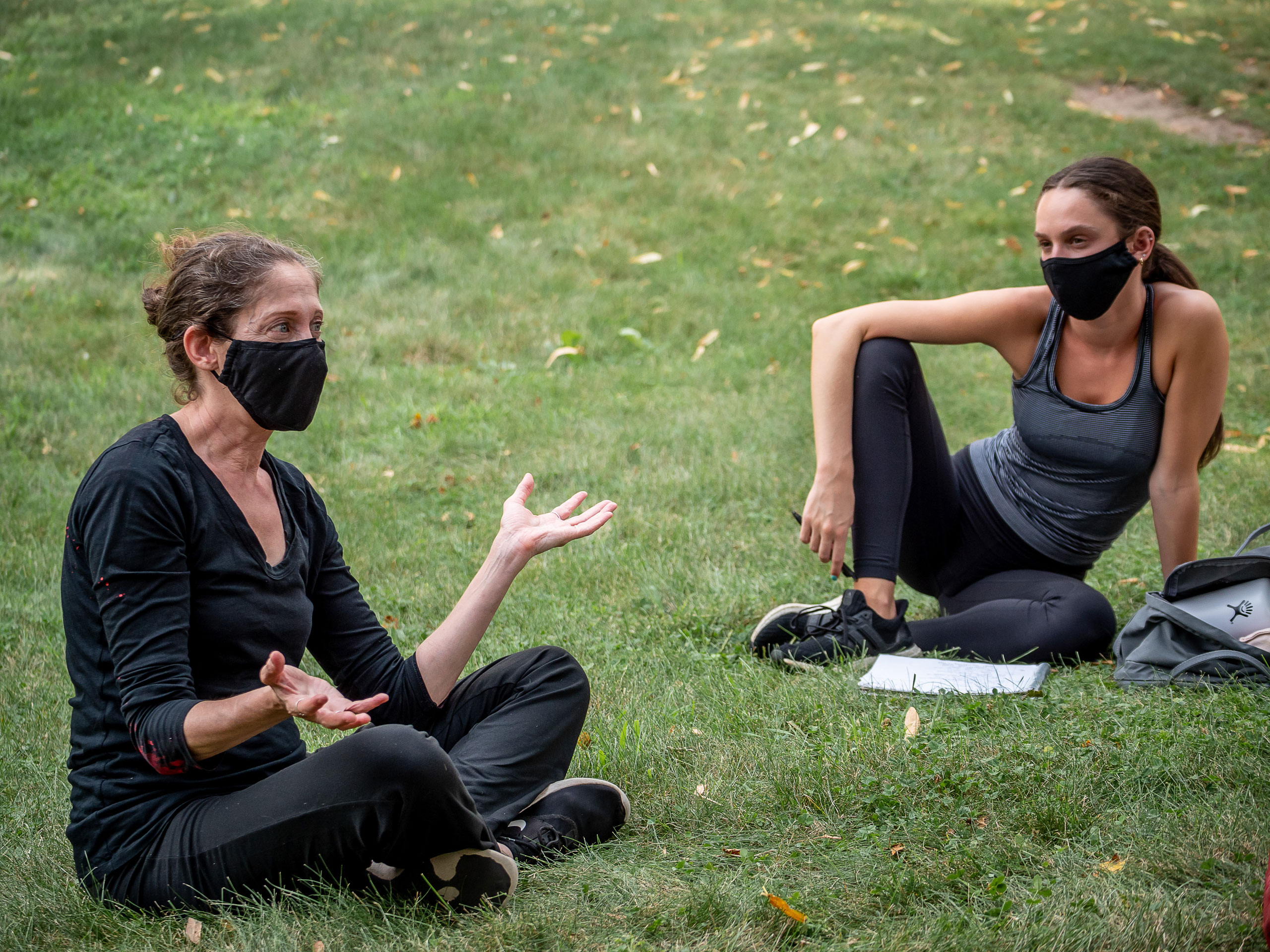 View of professor in student sitting on the main quad for outdoor class