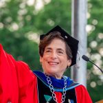 President Cole at lectern waving to the crowd
