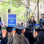 Dean Jan Smolowitz on stage, with President Koppell and Today Show hosts standing beside her.
