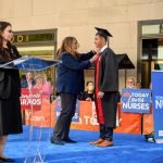 Alexander Ng receives his pin during the ceremony