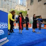 Nursing graduate Carin Adler shaking hands with Today Show host Hota Kotb