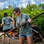 Student volunteers clearing debris