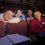 Four people, the music team for How to Dance in Ohio, sit in theater seats, smiling. 