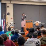 Montclair President Jonathan Koppell gestures while addressing MEGA participants.
