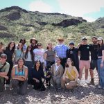 A group photo of students and professors in the desert.