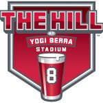 The red, black and gray logo for The Hill at Yogi Berra Stadium shaped like home plate.