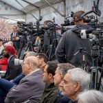 A line of camera operators.