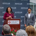 Laurie Newell speaks at the microphone