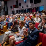 The audience applauds