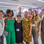 Seven people pose for a picture