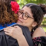 Angel Bernales and her mother Iliana Woodhull embrace.