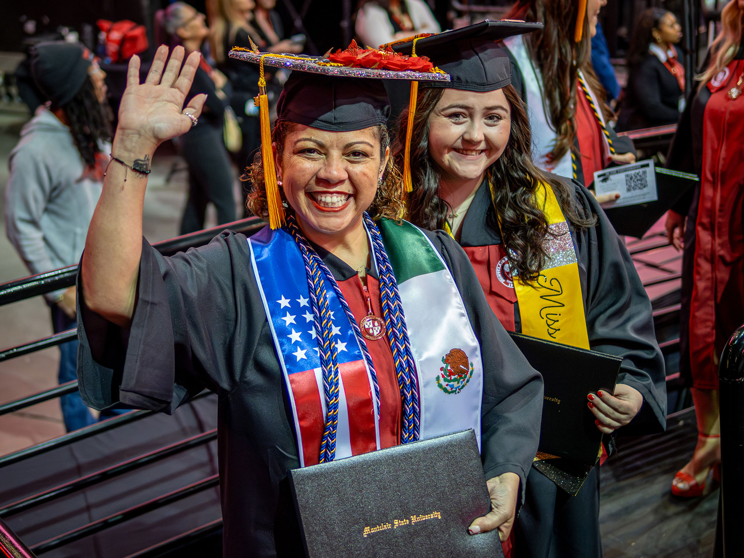 Iliana Woodhull smiles with her degree