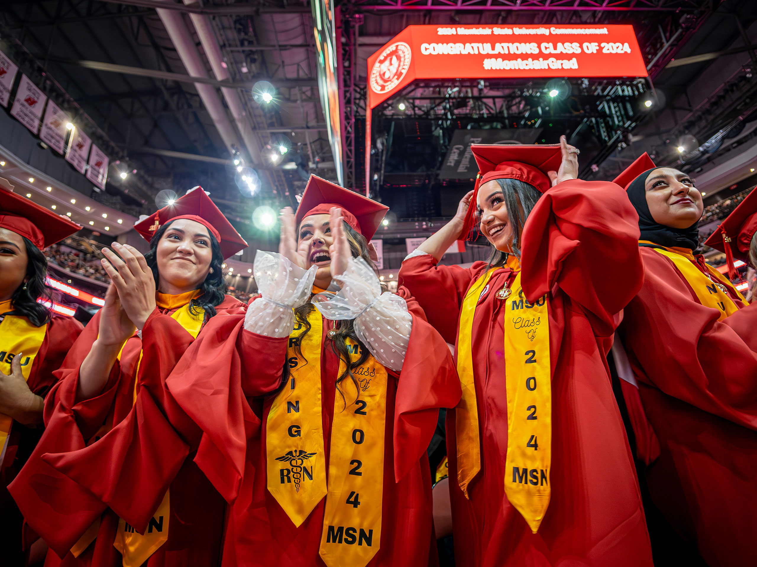 Master of Science in Nursing degree recipients clapping