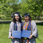 Angel Bernales and her mother Illiana Woodhull hold diplomas. 