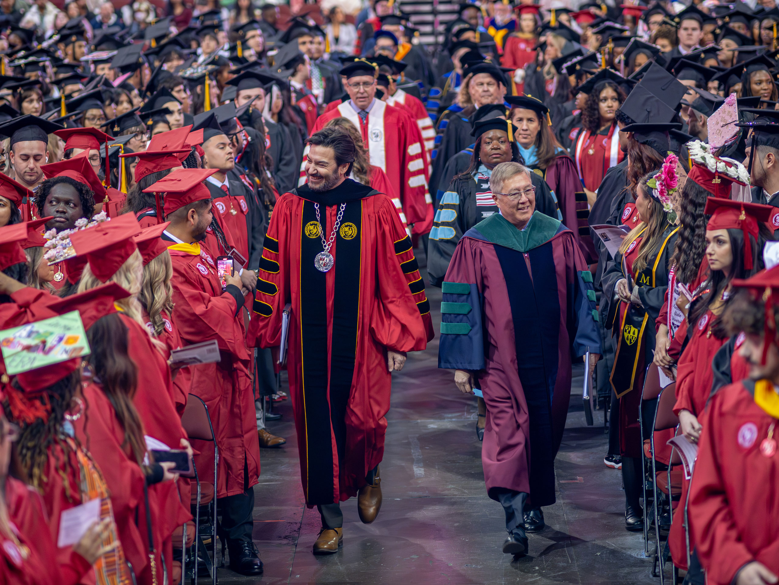 Montclair President Jonathan Koppell, on the left, and Provost Junius J. Gonzales, on the right, lead faculty and staff in the ceremonial procession.