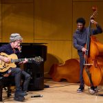 Jazz guitarist Pat Metheny performs with bass player Drew Tyson, a high school student.