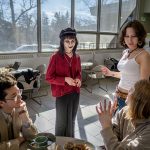 Katie visits with friends at lunchtime.