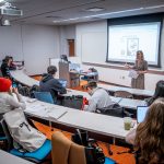 Associate Professor Pascale N. LaFountain stands at the front of a classroom as students listen.