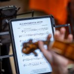 A closeup of sheet music on a digital tablet.