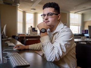 Abraham Rubio sits at a computer.