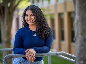 Angela Castro poses on Montclair State University campus.