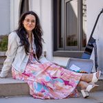 Alyssa Muñiz sits on a step.