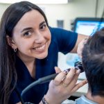Grace Gleba examines a patient at Montclair’s Audiology Clinic.