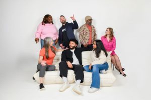 TEDx Montclair speakers gather for a group photo. Standing are Jade Walters, Chris W. Fitzpatrick, Gary J. Nix; Paige Swanstein is seated on chair. Sitting on a couch are Kathleen Culver, Nick Fuentes-Zuluaga and Anjali Badrinath.