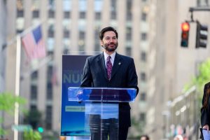 President Jonathan Koppell standing at the podium.
