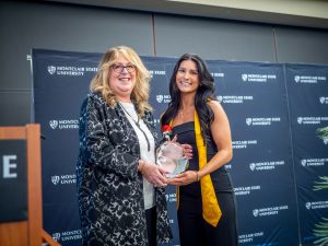 Nursing graduate receives award at the Pinning Ceremony.