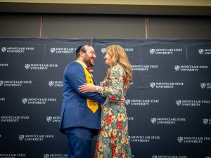 Male nursing student being pinned by his wife at the Pinning Ceremony.