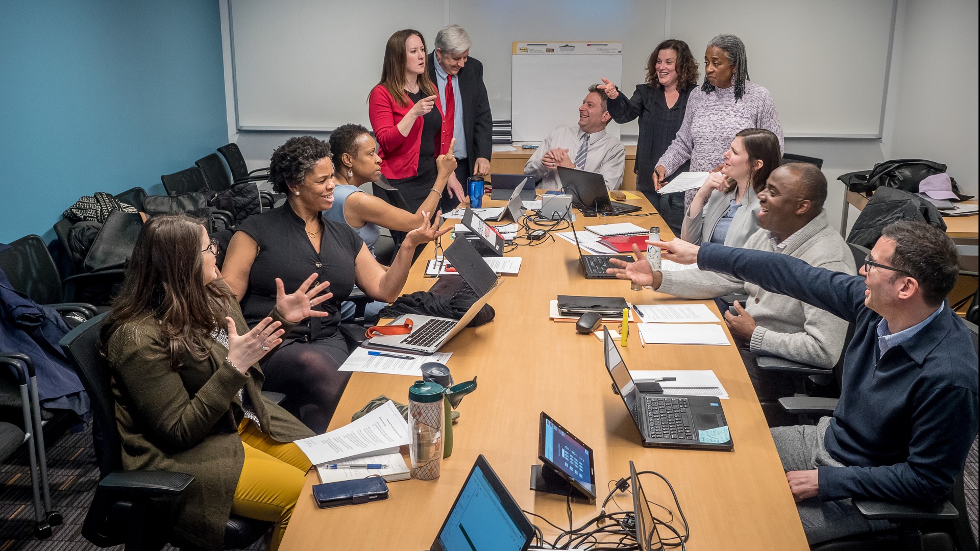 The University College Advisory Team, seated around a conference table.