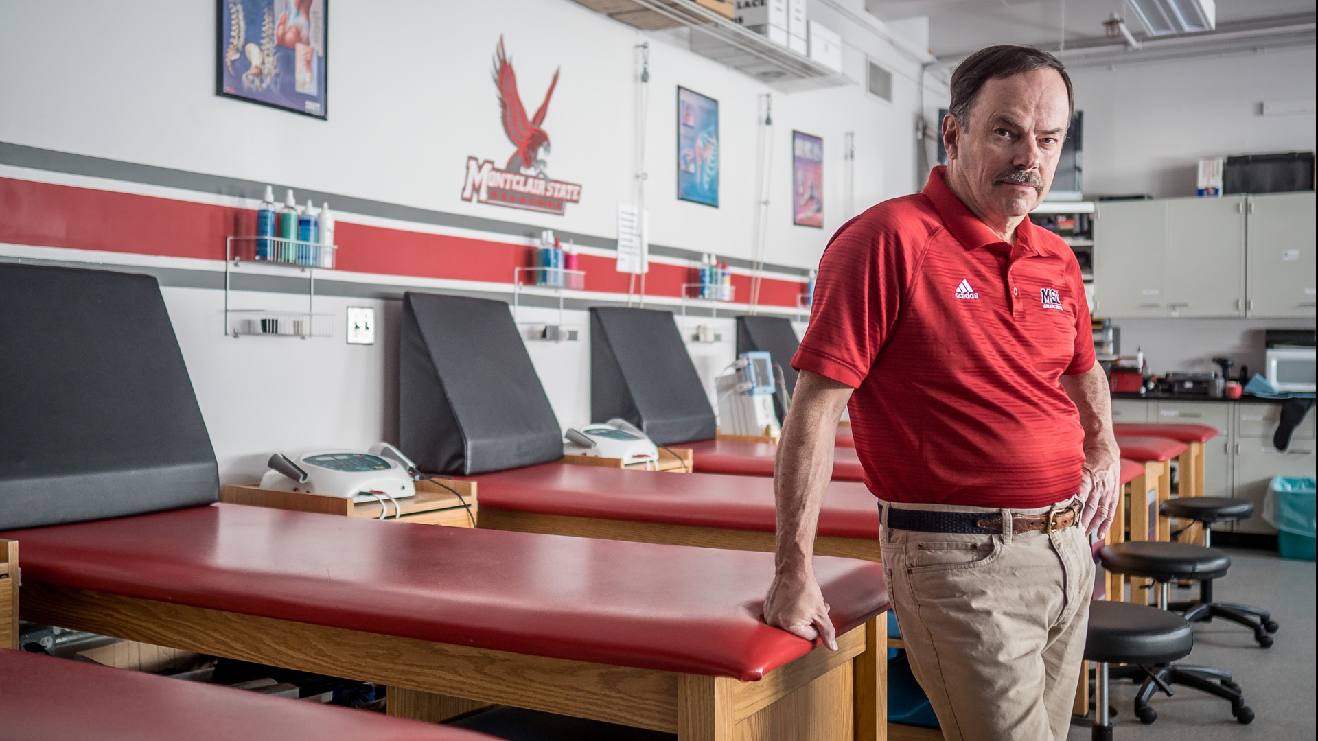 John Davis, the University's Head Athletic Trainer, standing in a training room.