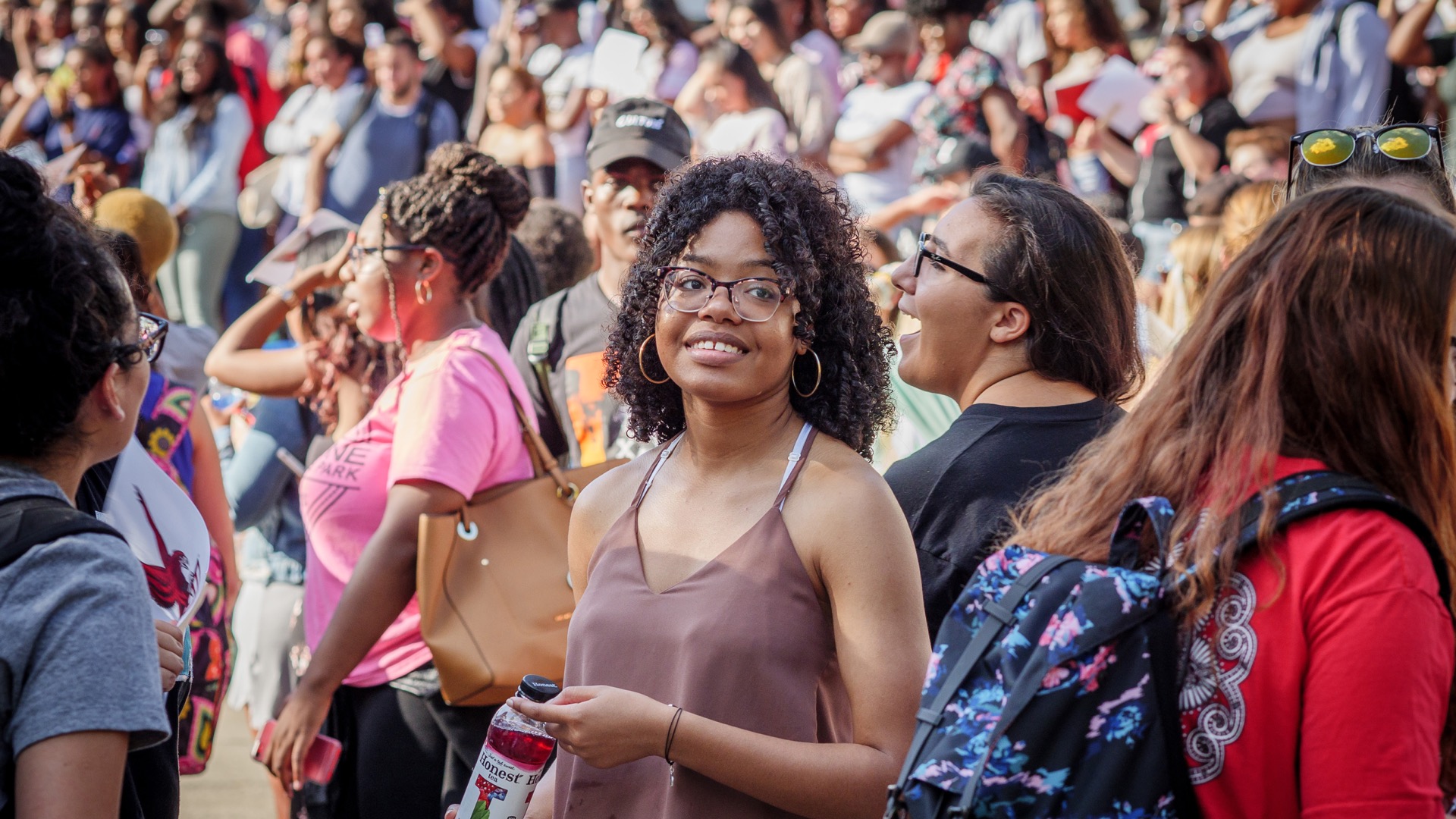 Students, alumni and parents enjoying a homecoming presentation.