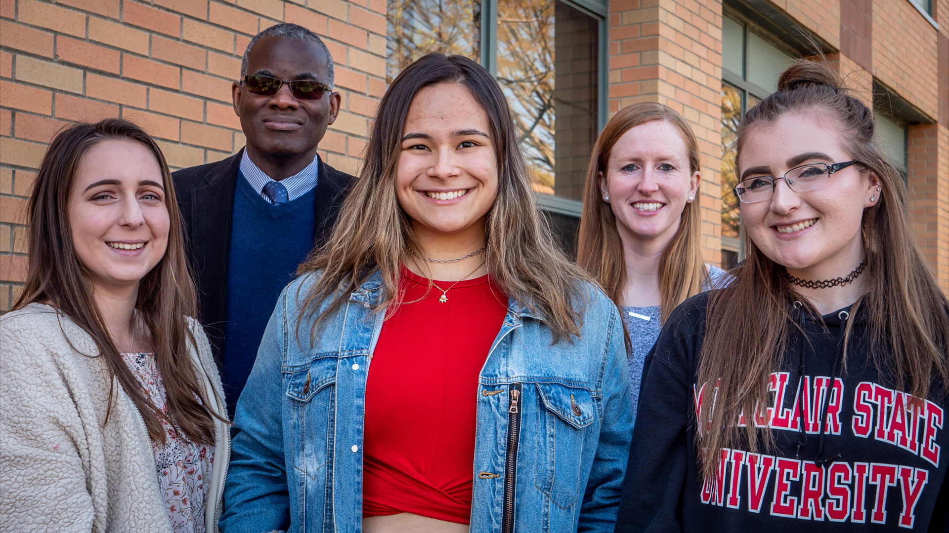 Smiling students facing camera