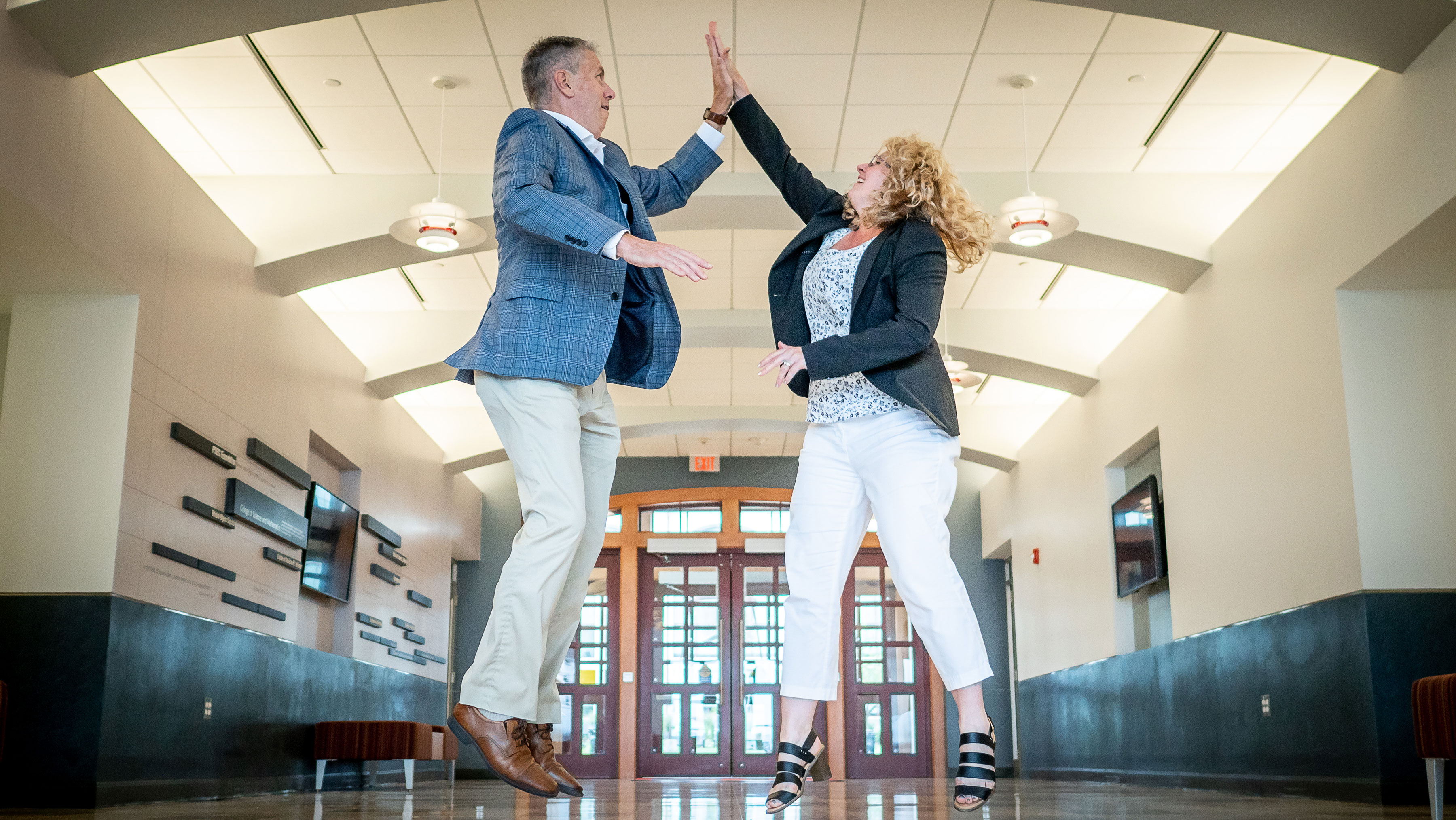 Deans Cant and Billings high fiving