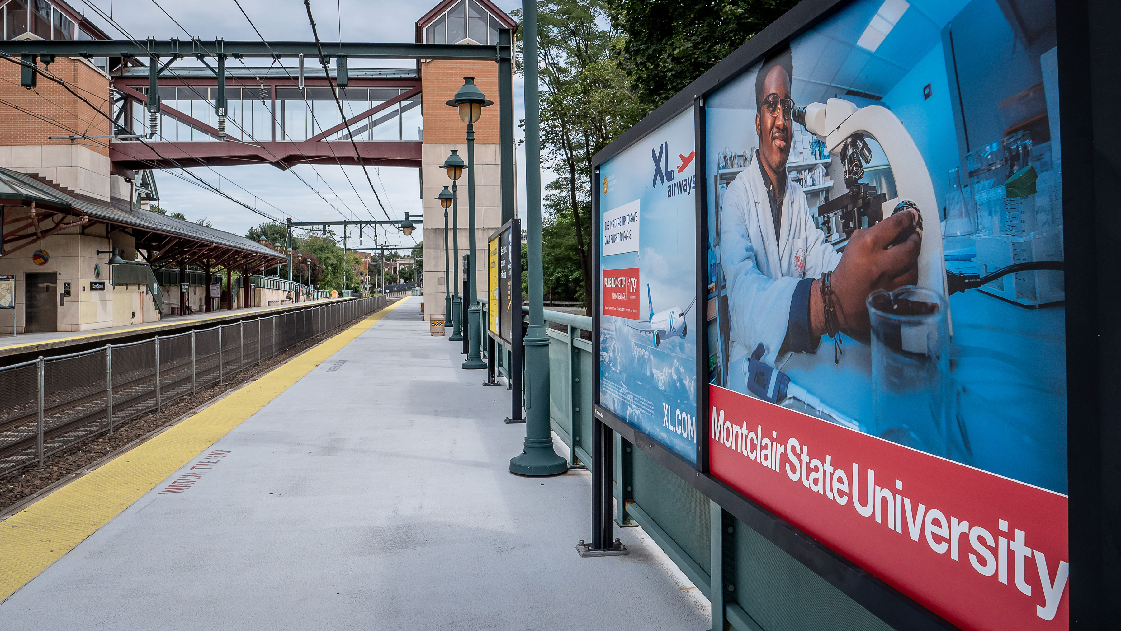 University billboard at Bay Street Station