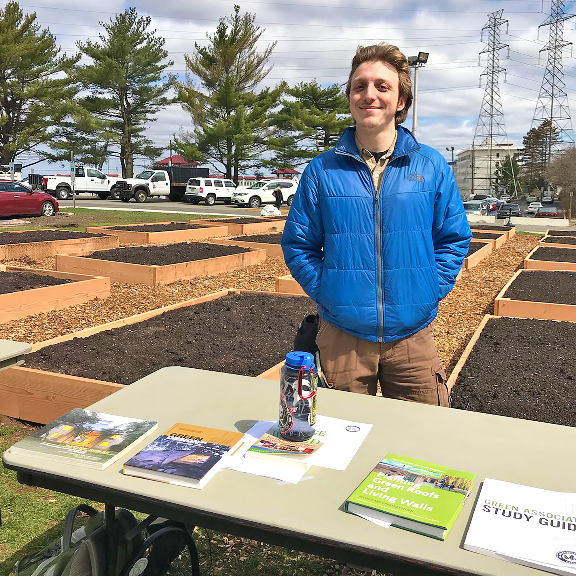 Christopher Snyder in front of new community garden