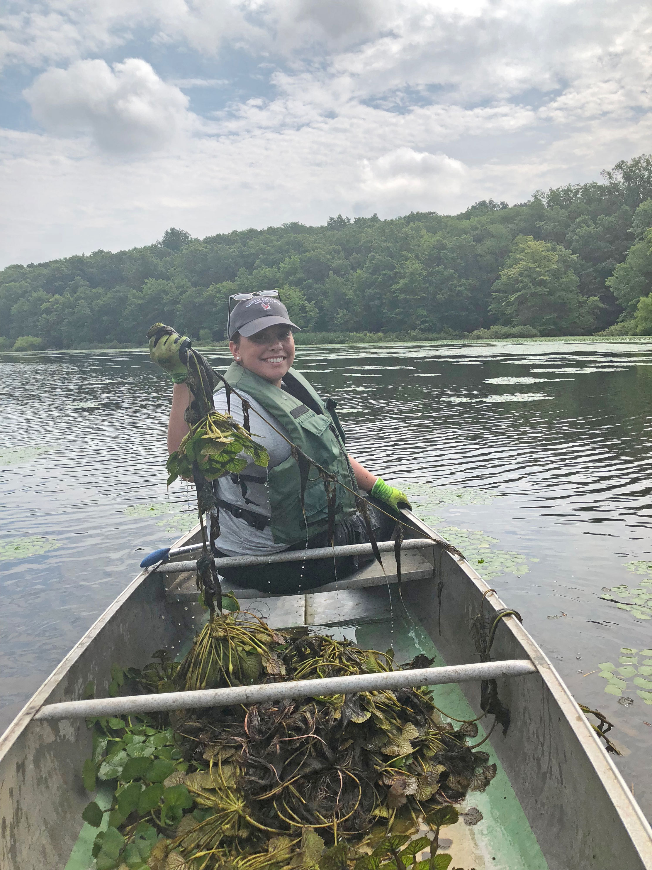 team Suez volunteering at water chestnut pull