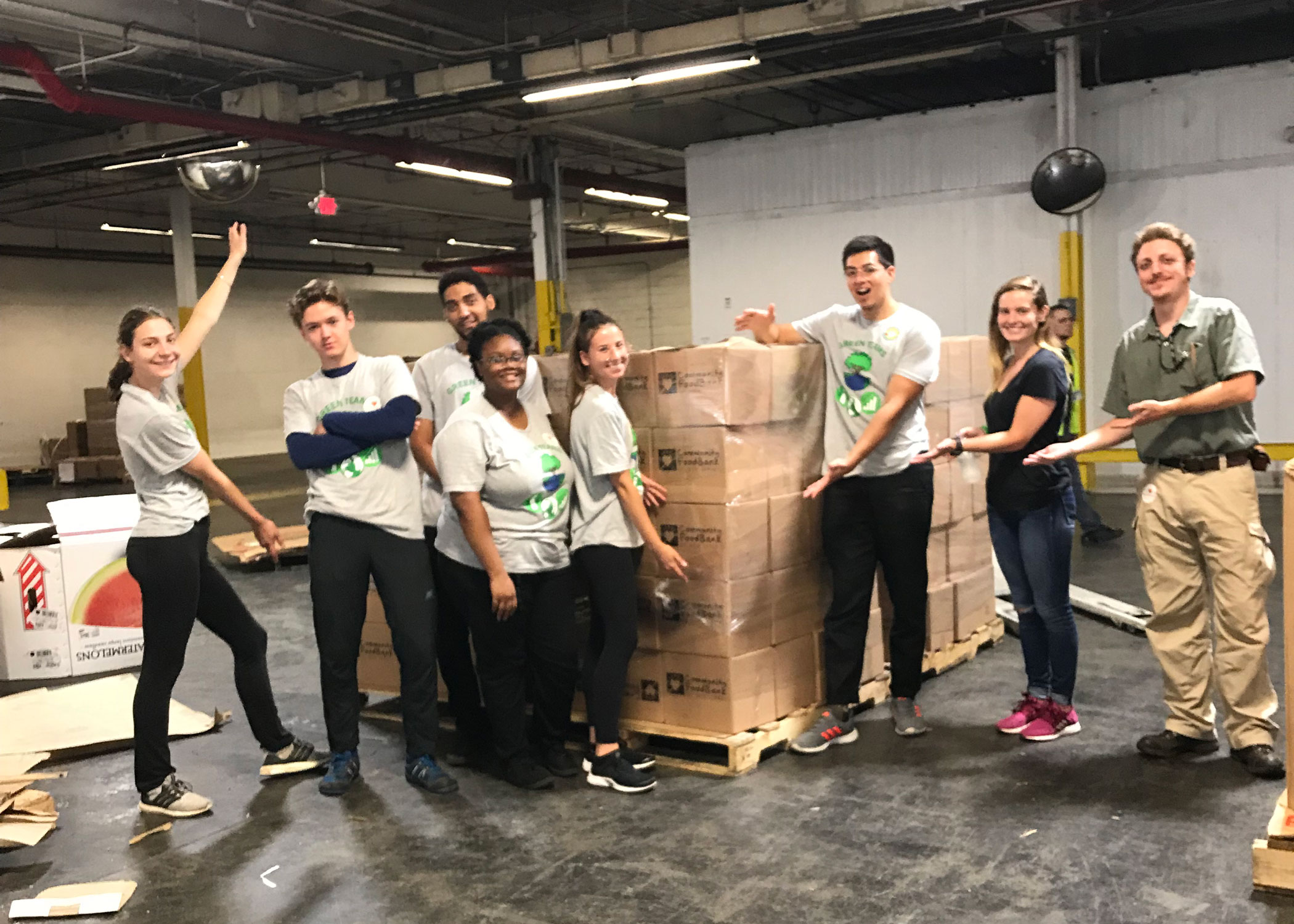 Green Team cleaning warehouse