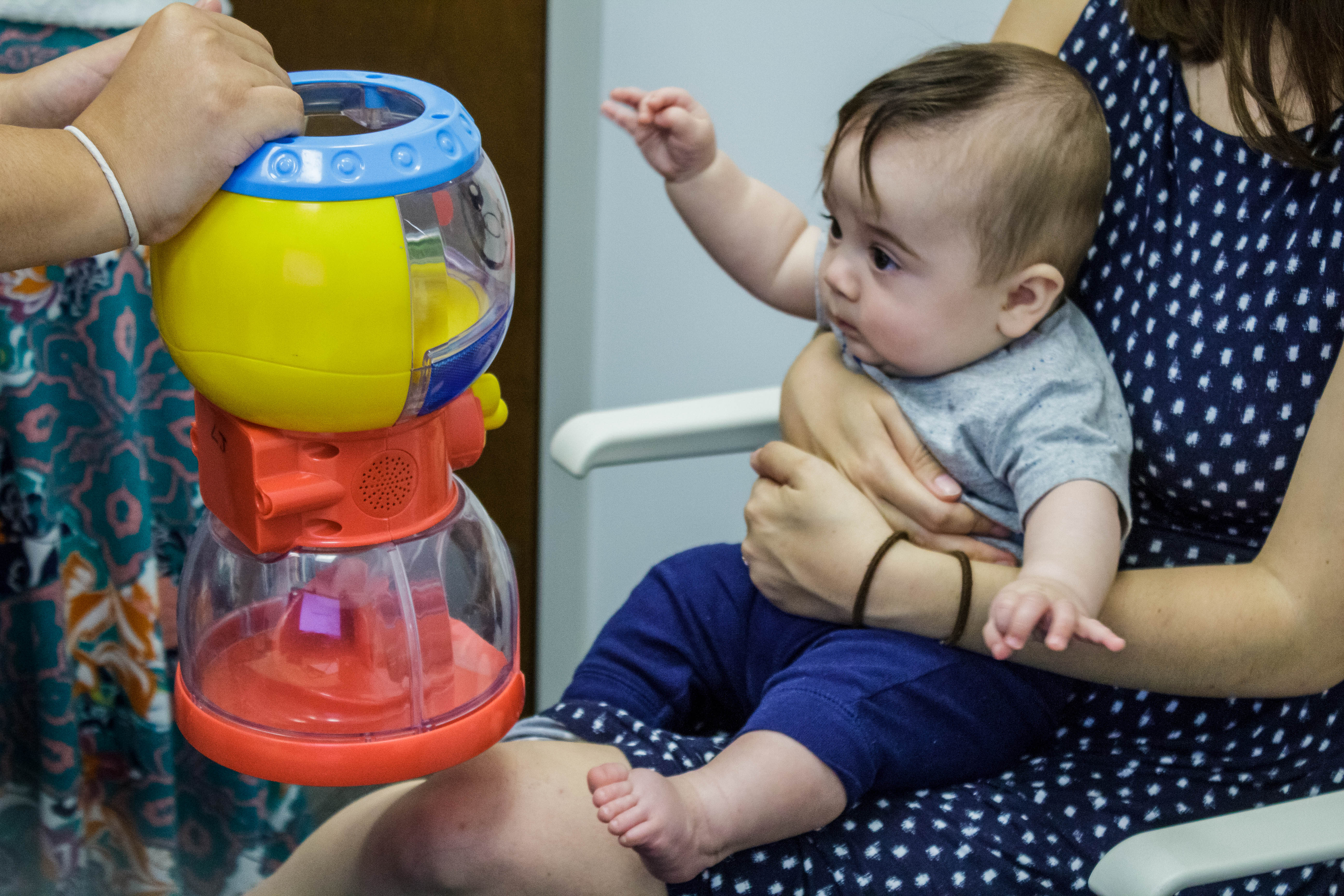 baby playing with the toy.