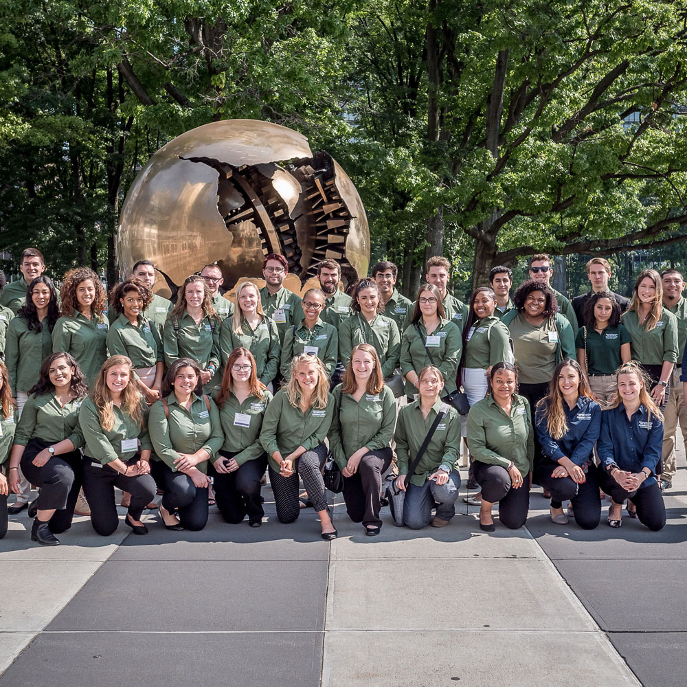 PSEG Green Teams' Students in front of sphere sculpture