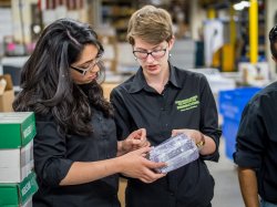 Photo of Sustainability Studies students at printing warehouse.