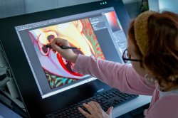 Illustration student painting on a digital screen