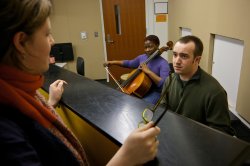 Instructor speaking to students over a wall