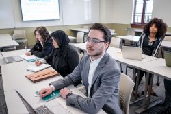 Students taking notes in class