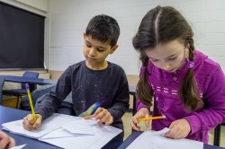 Young children working on a school project.